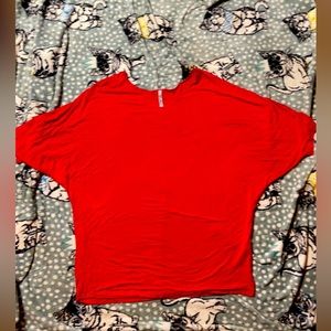 Bright red loose fitting t shirt.